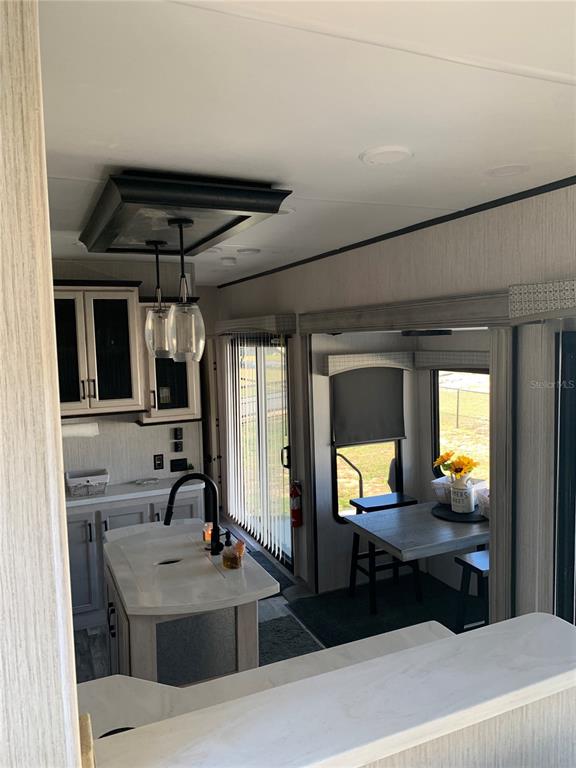 15991 Northeast 243rd Place Road, Unit 143 Fort McCoy, FL 32134 - Photo 16 of 35 a bathroom with a sink and a mirror