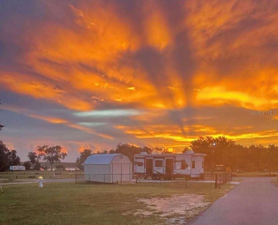 15991 Northeast 243rd Place Road, Unit 143 Fort McCoy, FL 32134 - Photo 2 of 35 a view of houses with sky view