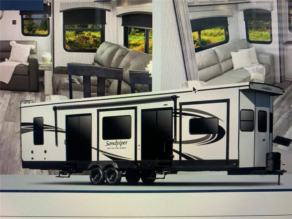 15991 Northeast 243rd Place Road, Unit 143 Fort McCoy, FL 32134 - Photo 21 of 35 a living room with furniture