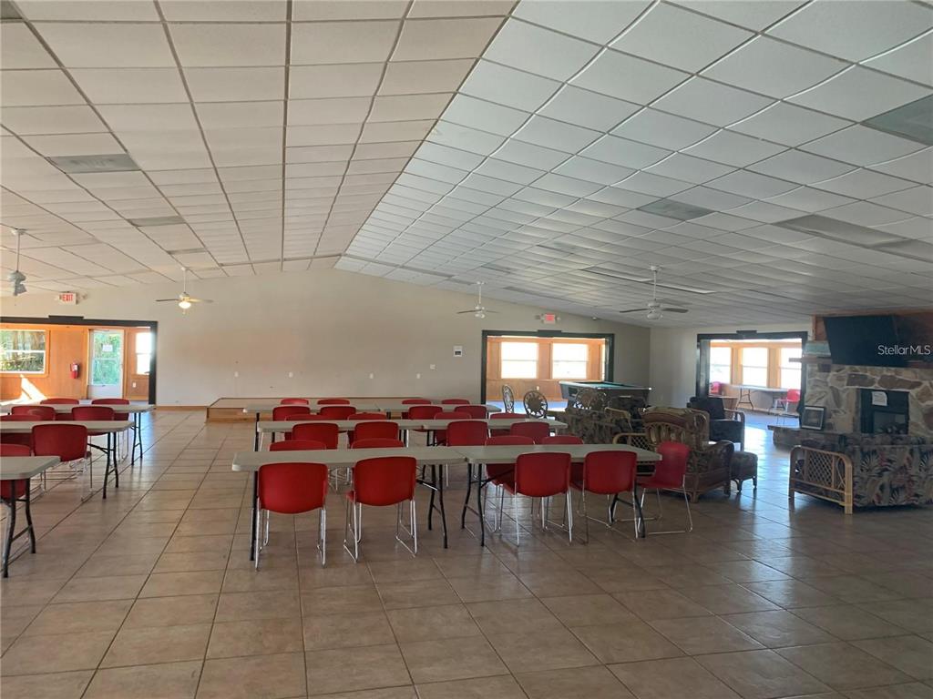 15991 Northeast 243rd Place Road, Unit 143 Fort McCoy, FL 32134 - Photo 26 of 35 a view of a dining room with furniture window and outside view