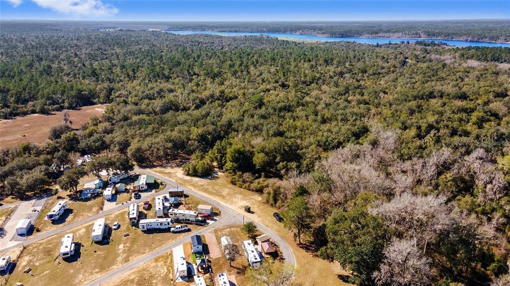 15991 Northeast 243rd Place Road, Unit 143 Fort McCoy, FL 32134 - Photo 35 of 35 an aerial view of multiple house