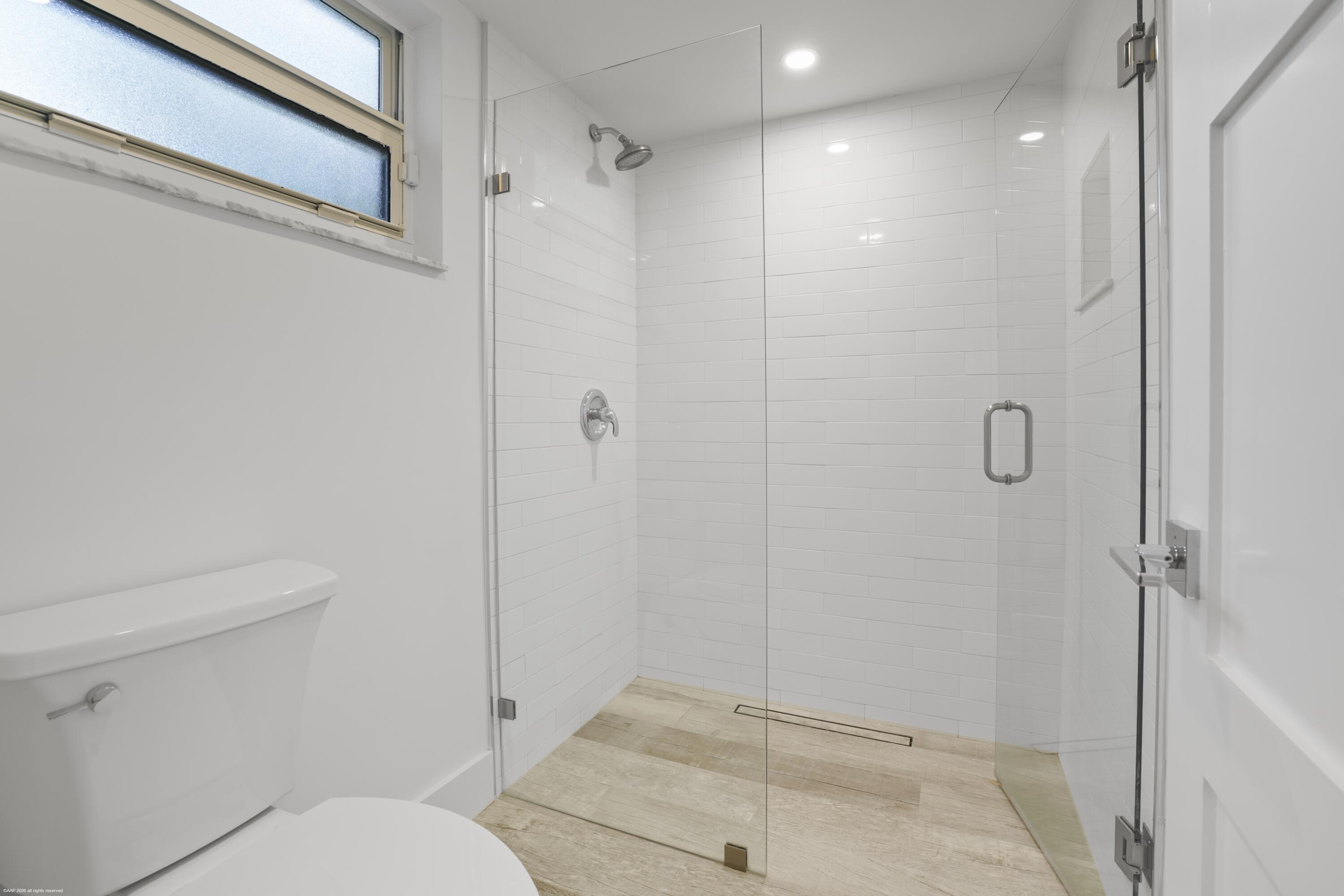 13334 Polo Club Road, Unit 234 Wellington, FL 33414 - Photo 15 of 41 a bathroom with a shower and toilet