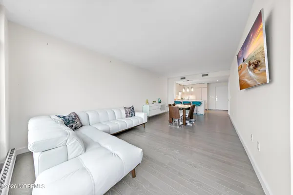 a living room with furniture and a table