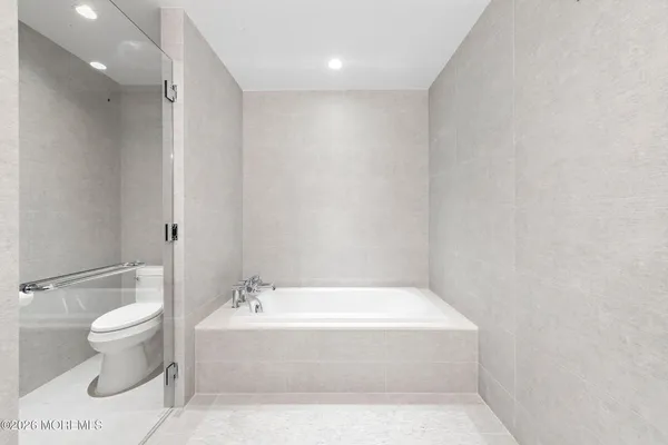 a bathroom with a bathtub and sink