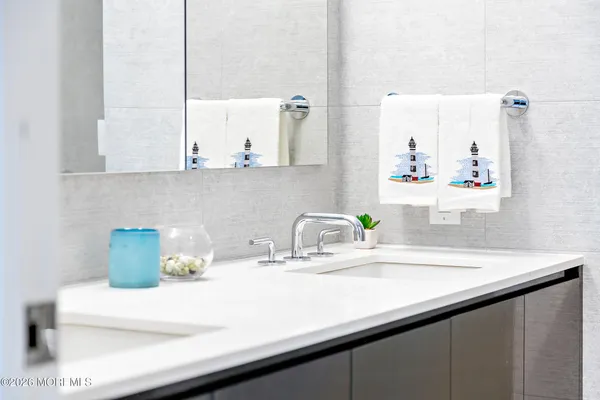 a kitchen with a sink and a potted plant on the counter