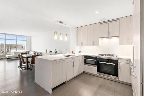 a kitchen with a stove and a refrigerator