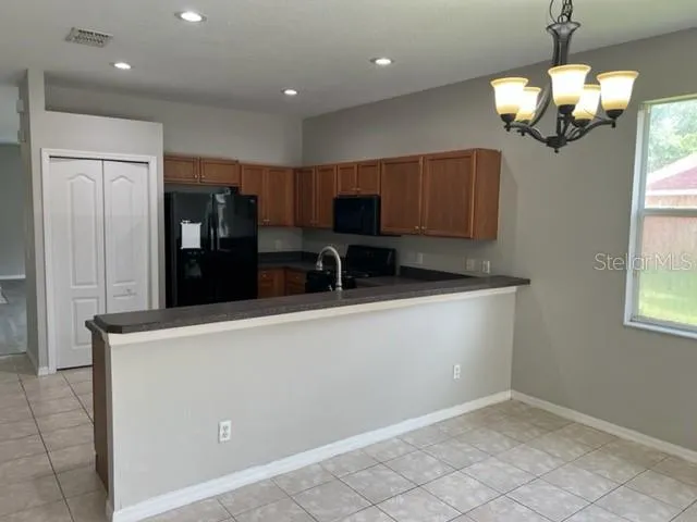 a kitchen with stainless steel appliances a refrigerator and a sink