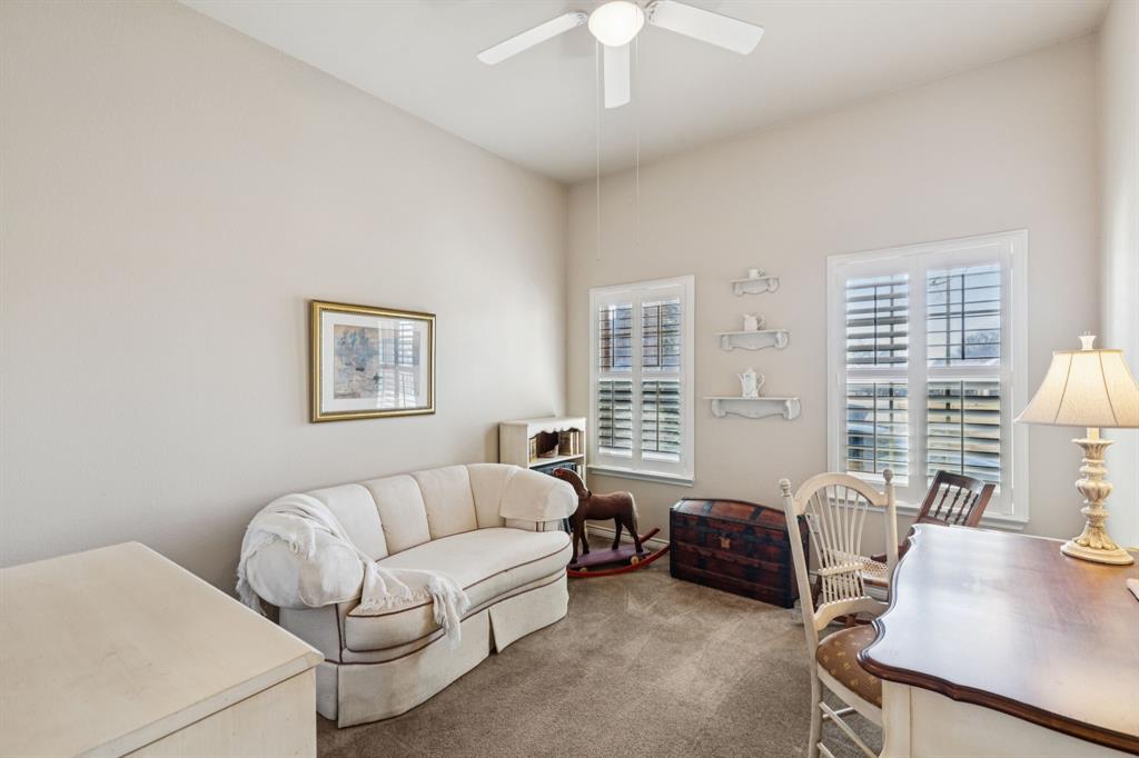 1805 Harlequin Place Allen, TX 75002 - Photo 22 of 33 Split secondary bedroom has walk in closet, carpet, ceiling fan and plantation shutters.
