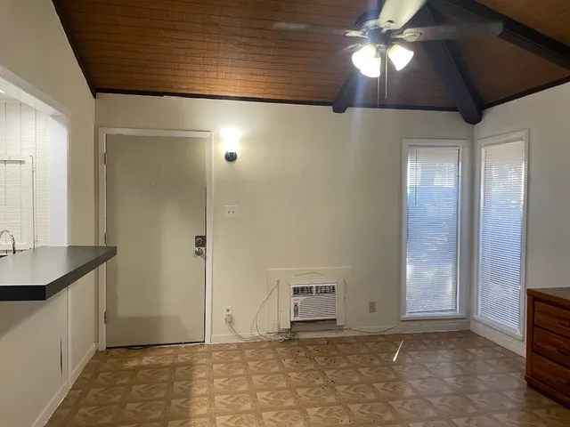 a bedroom with a bed and a mirror