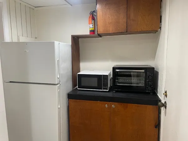 a white refrigerator freezer sitting in a kitchen