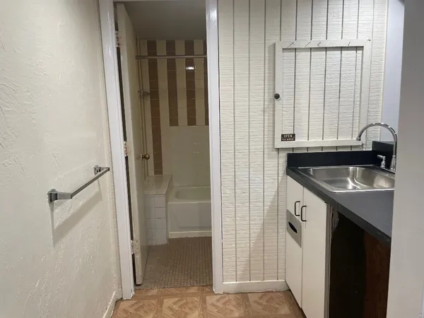 a view of a kitchen from the hallway