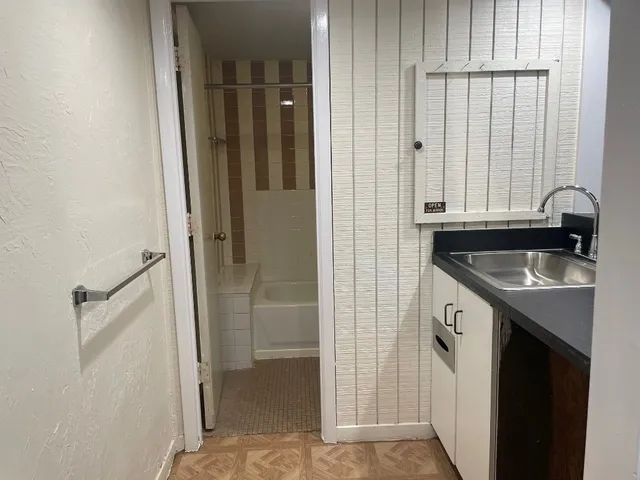 a view of a kitchen from the hallway