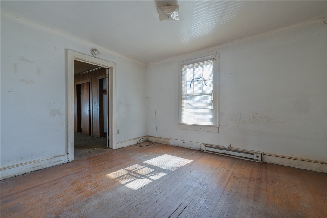 106 Frances Street Anderson, SC 29621 - Photo 7 of 15 This interior space features beautiful hardwood flooring and a classic window with blinds.