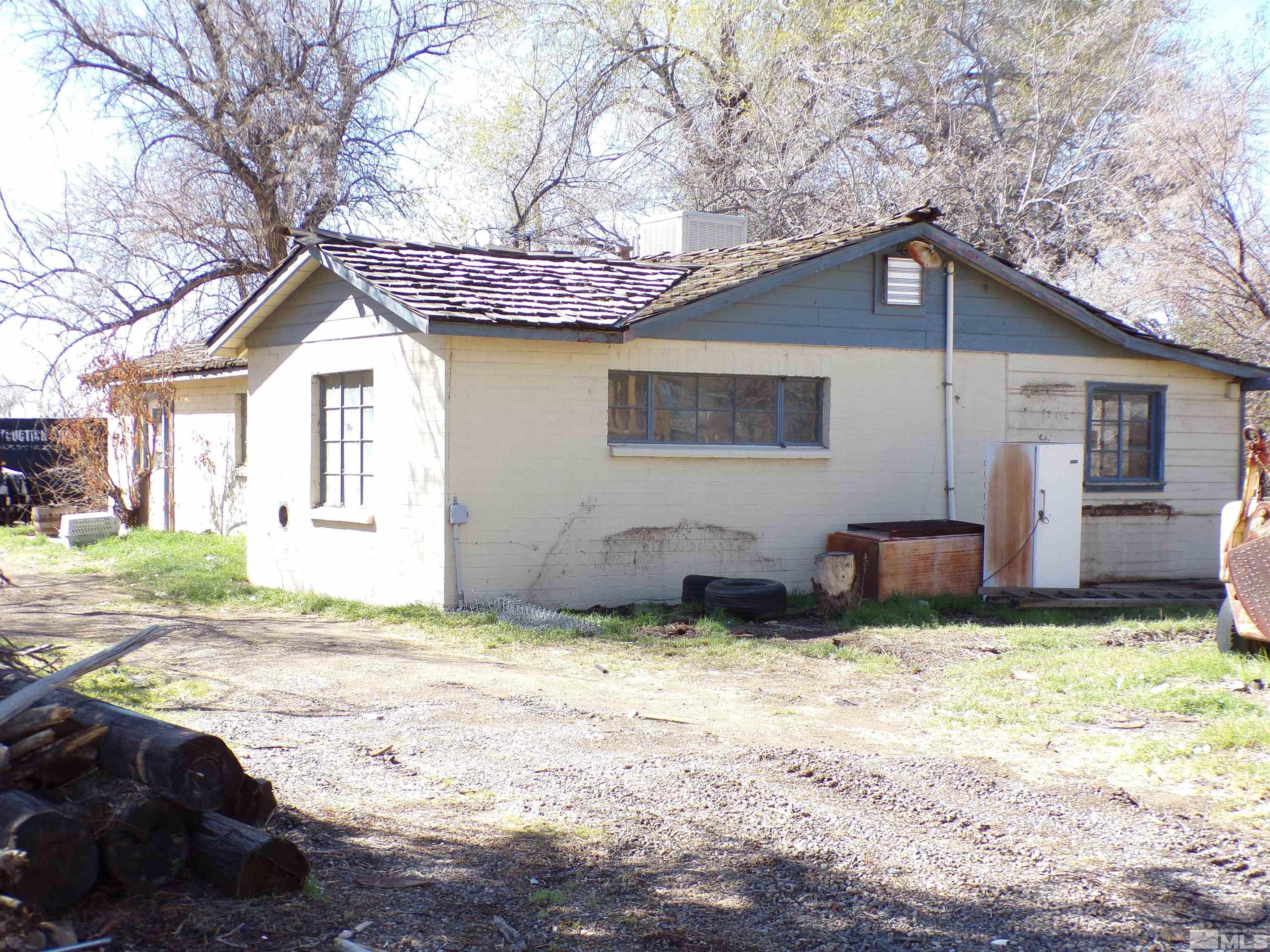 5890 Rivers Edge Drive Fallon, NV 89406 - Photo 14 of 24 a view of a house with a yard covered in snow
