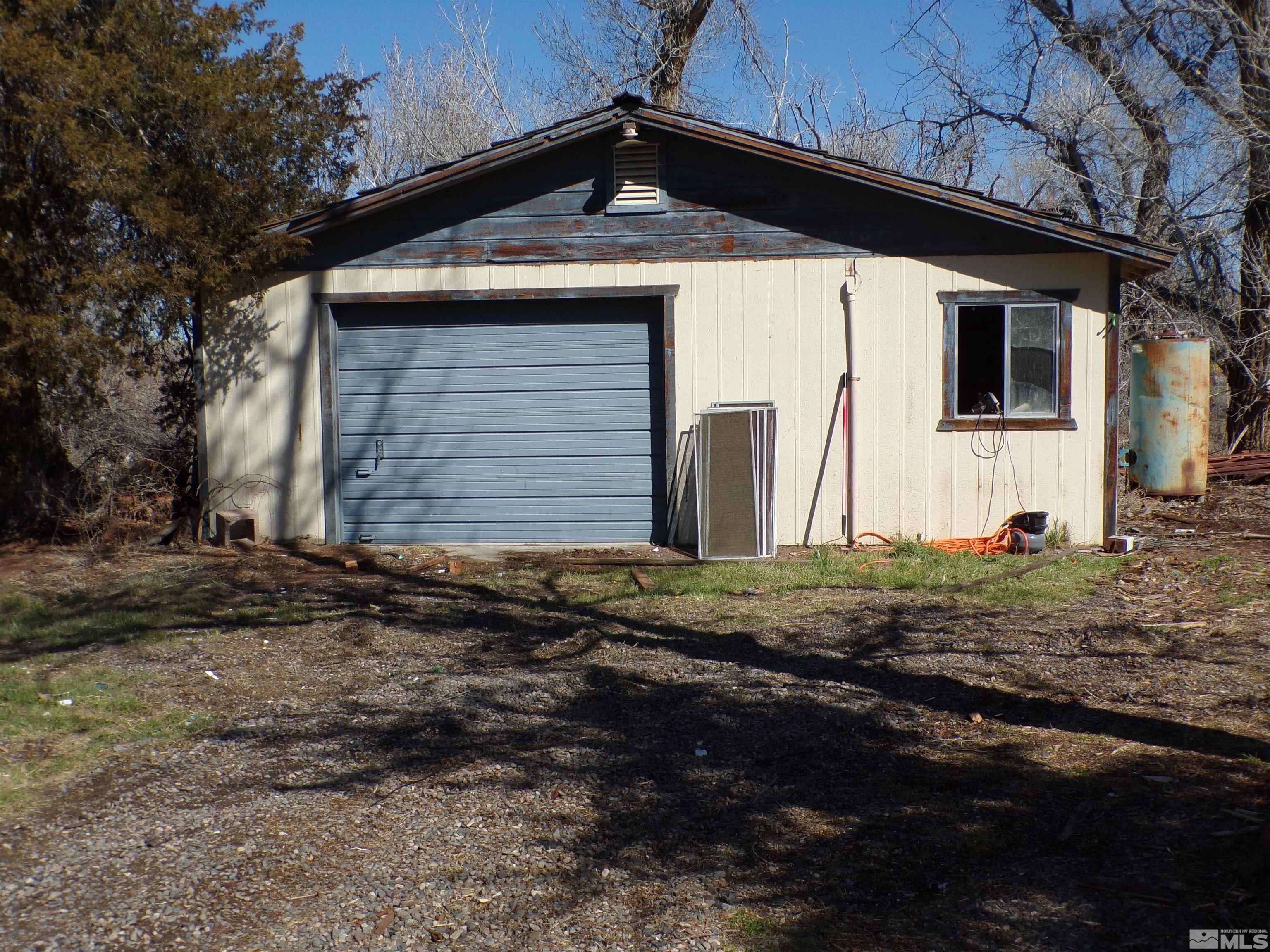 5890 Rivers Edge Drive Fallon, NV 89406 - Photo 18 of 24 a front view of a house with a yard