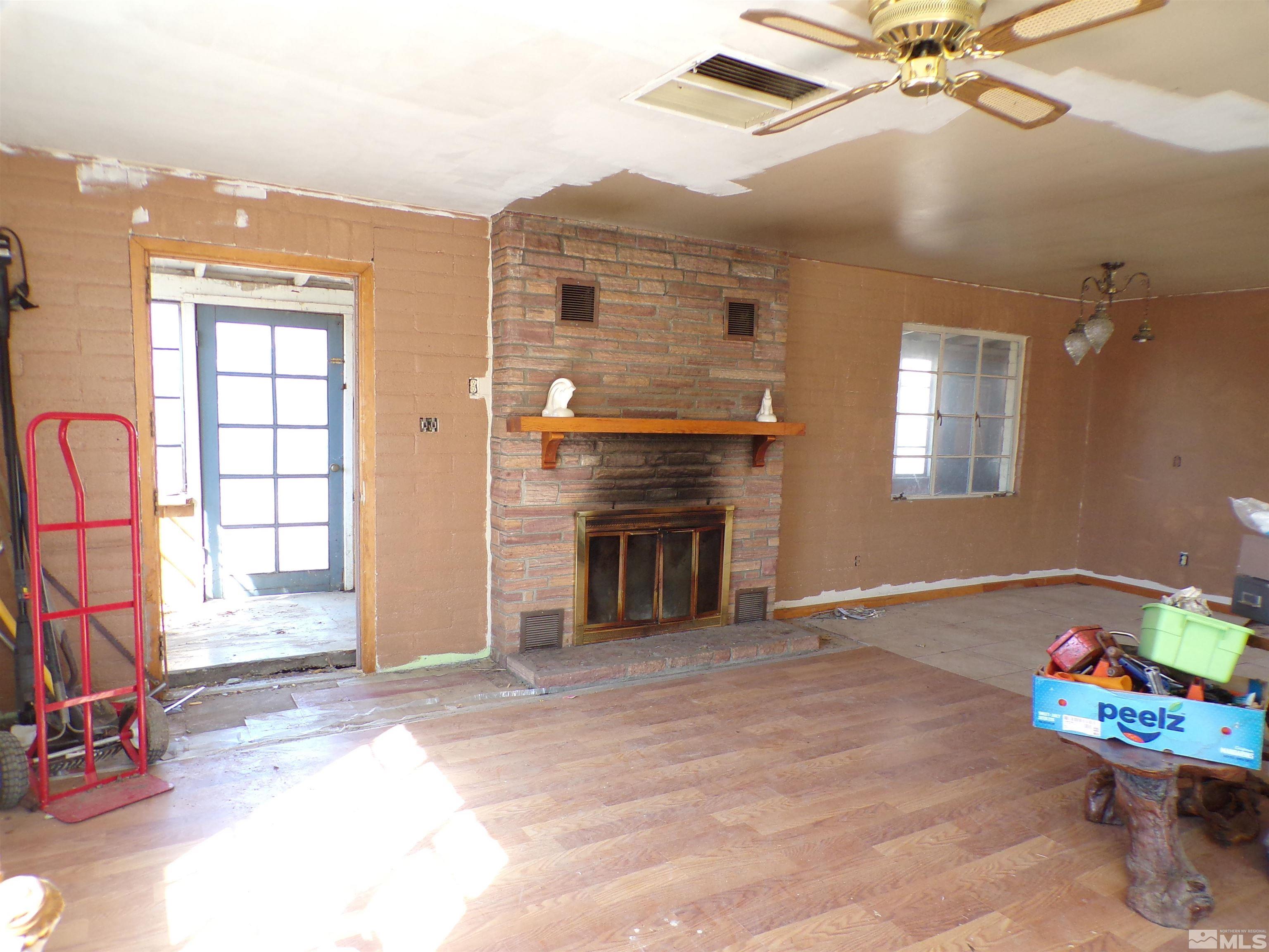 5890 Rivers Edge Drive Fallon, NV 89406 - Photo 2 of 24 a view of a livingroom with a fireplace