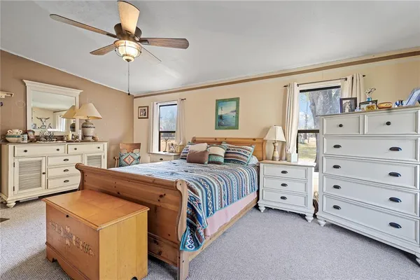 a bed room with a bed and a dresser