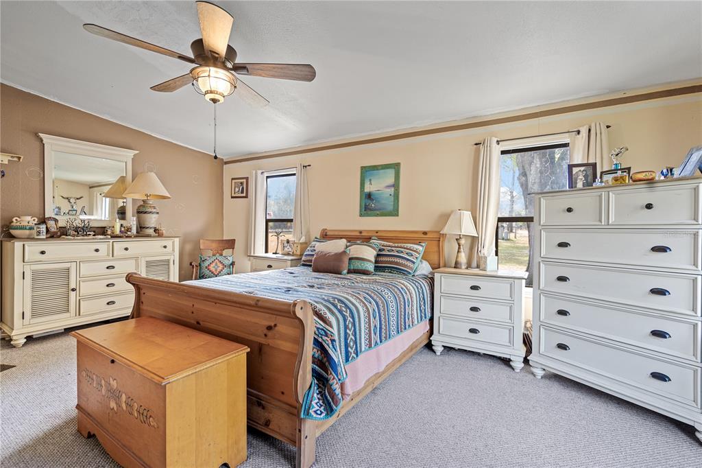 7201 Northeast 132nd Place Citra, FL 32113 - Photo 15 of 37 a bed room with a bed and a dresser