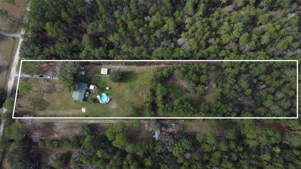 7201 Northeast 132nd Place Citra, FL 32113 - Photo 2 of 37 an aerial view of a house with a yard