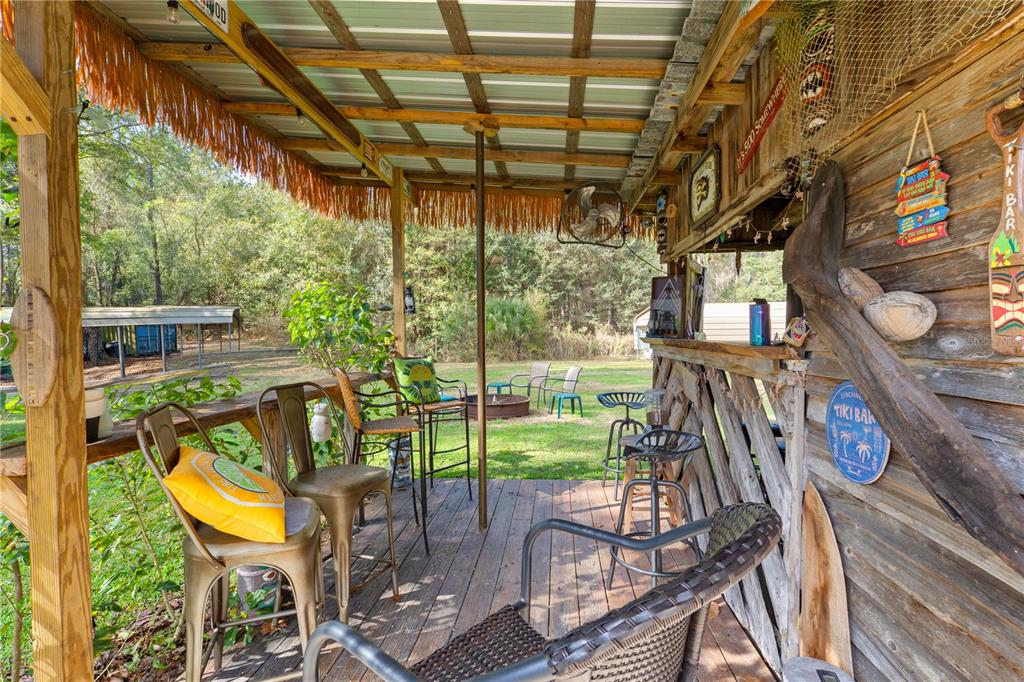 7201 Northeast 132nd Place Citra, FL 32113 - Photo 25 of 37 a view of a chairs and table in a patio