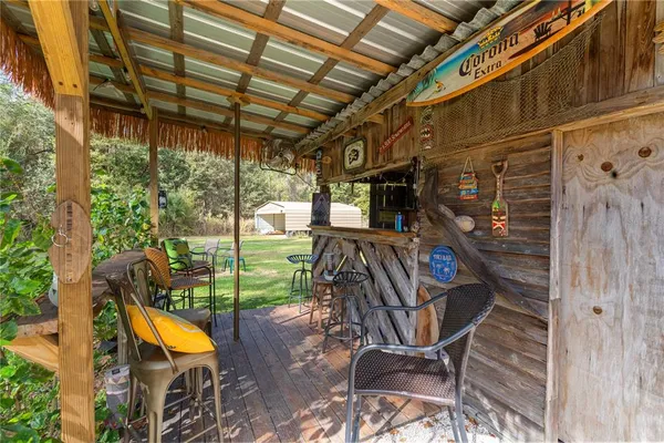 a view of a chairs and table in the patio