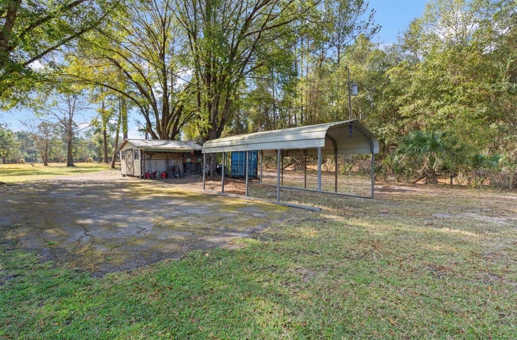 7201 Northeast 132nd Place Citra, FL 32113 - Photo 30 of 37 a view of a house with a yard