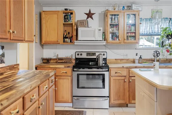 a kitchen with cabinets appliances and a sink