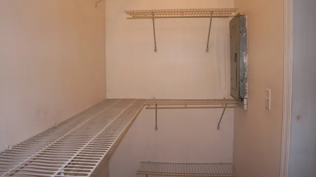 a view of an empty room with a window