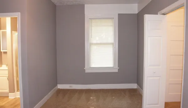 a white toilet sitting next to a bathroom sink