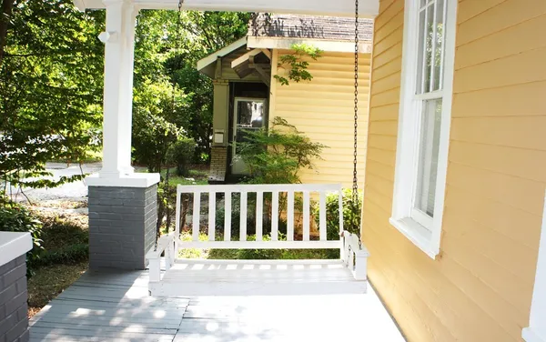 a side view of a house with a yard