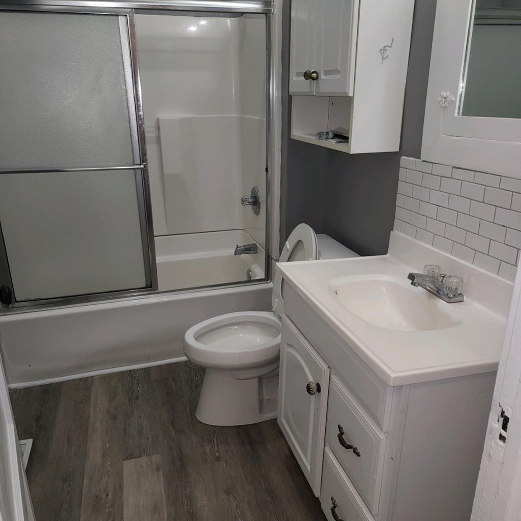 1336 19th Street Columbus, GA 31901 - Photo 9 of 20 a bathroom with a sink toilet and shower