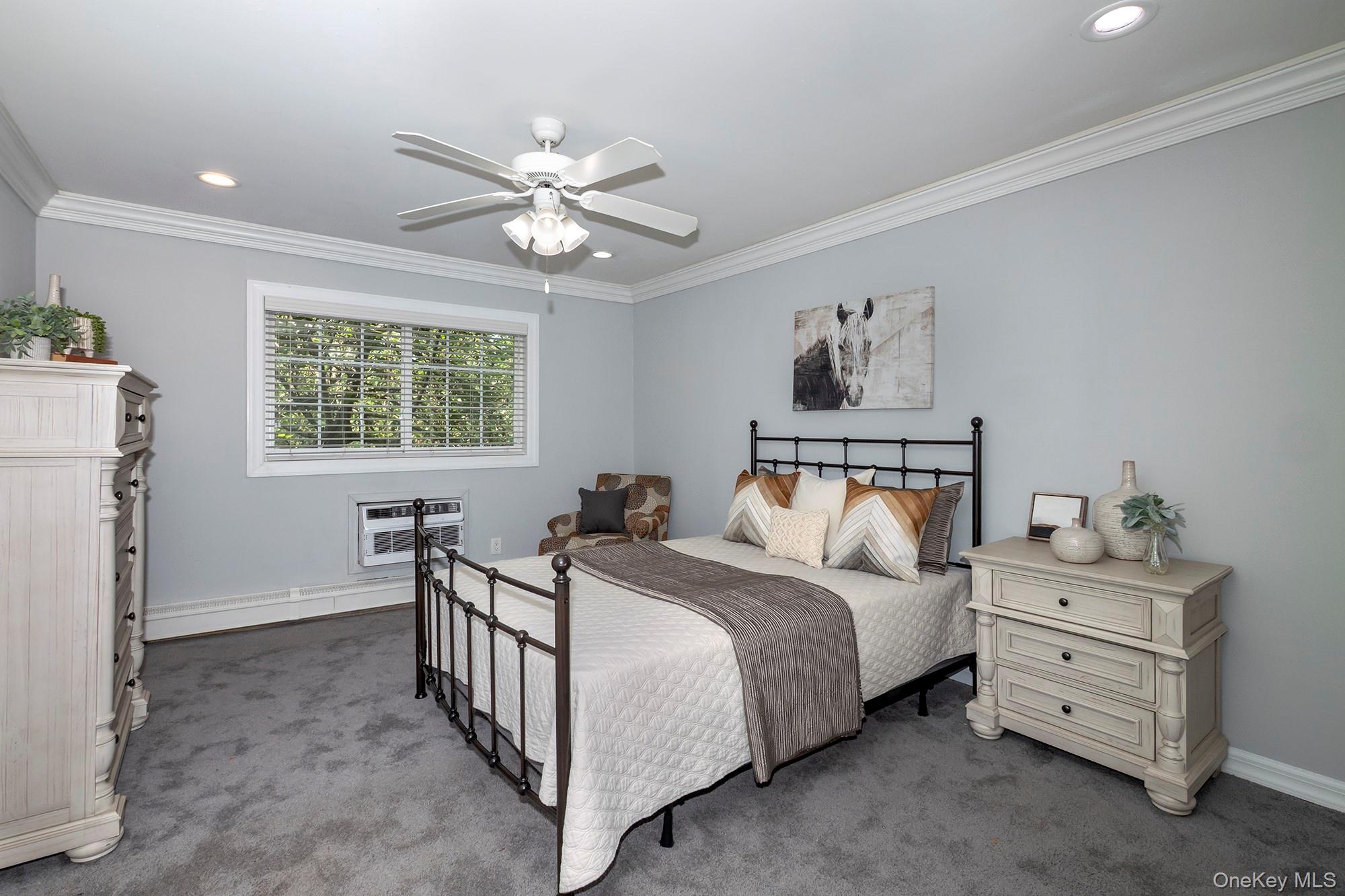 70 Middleton Road, Unit SF05 Bohemia, NY 11716 - Photo 7 of 9 a bedroom with a bed and a window