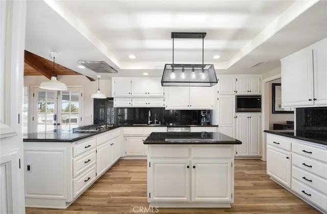 a kitchen with stainless steel appliances a stove and cabinets