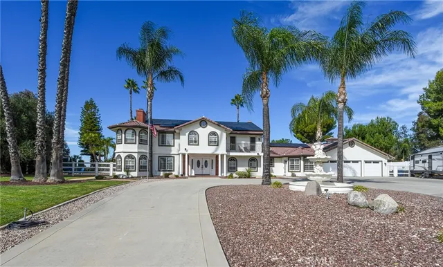 a view of multiple houses with a yard