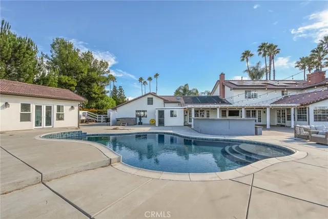 a view of a patio with a table and chairs