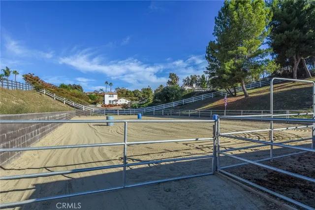 an aerial view of a house with yard swimming pool and outdoor seating