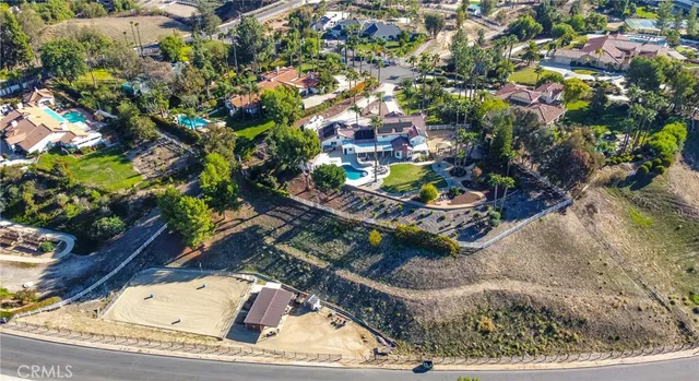 a aerial view of a house with a yard basket ball court