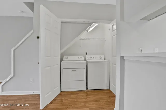 a view of a storage & utility room with a sink