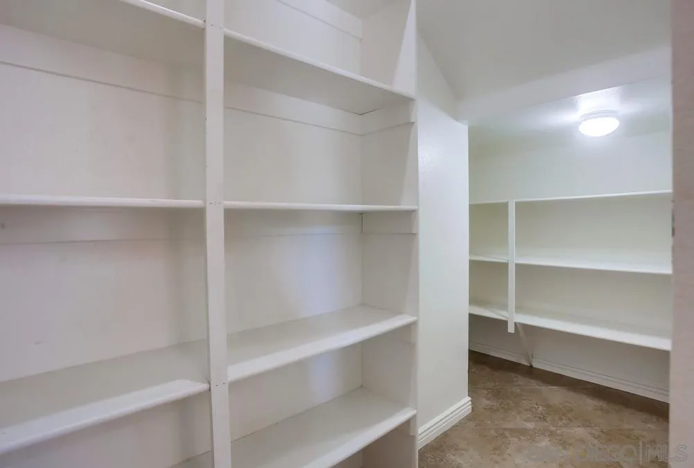 5163 Riverview Court Fallbrook, CA 92028 - Photo 17 of 75 a view of walk in closet with empty racks