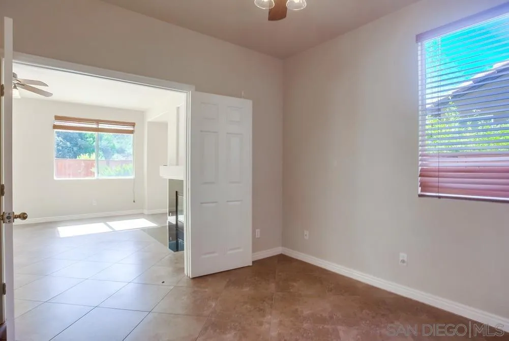 5163 Riverview Court Fallbrook, CA 92028 - Photo 21 of 75 an empty room with windows and closet