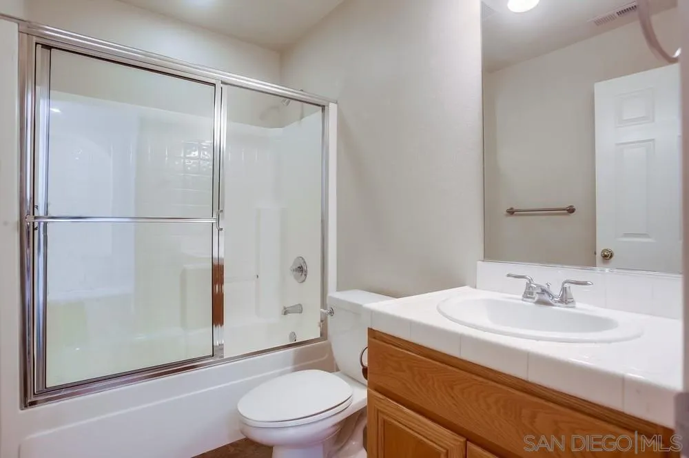 5163 Riverview Court Fallbrook, CA 92028 - Photo 22 of 75 a bathroom with a sink toilet and shower