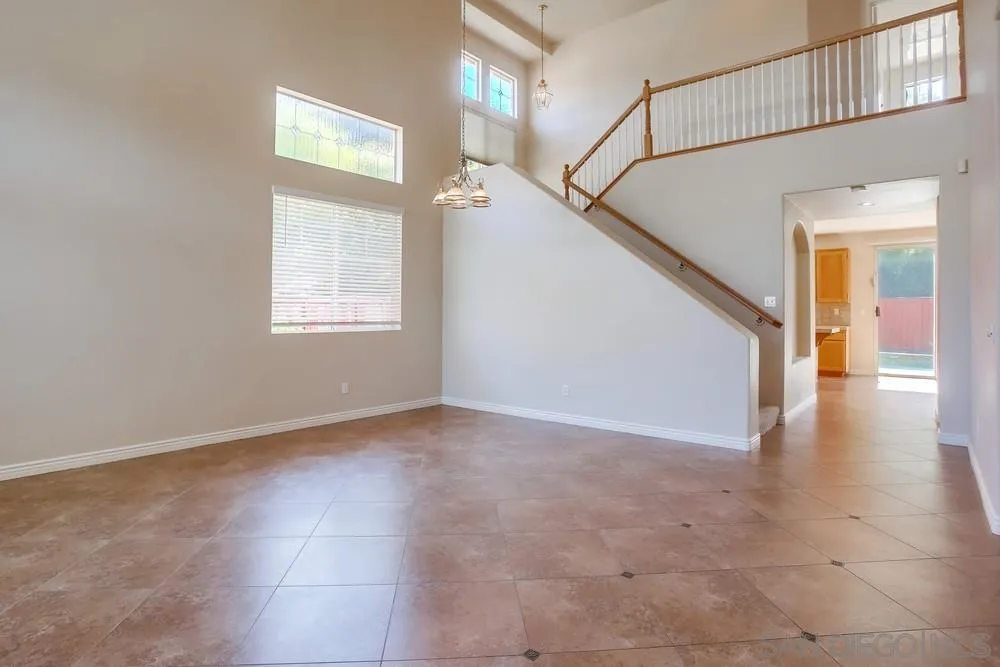 5163 Riverview Court Fallbrook, CA 92028 - Photo 3 of 75 a view of an empty room with wooden floor and a window