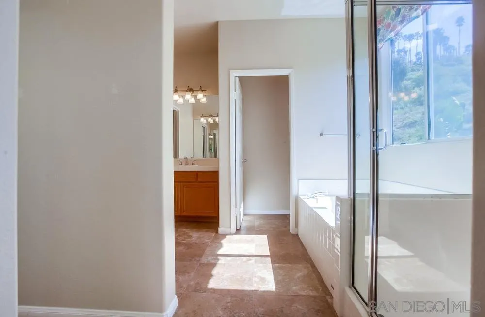 5163 Riverview Court Fallbrook, CA 92028 - Photo 37 of 75 a view of a hallway with a glass door and couch