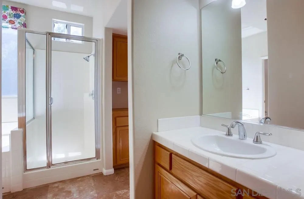 5163 Riverview Court Fallbrook, CA 92028 - Photo 39 of 75 a bathroom with a sink and a mirror