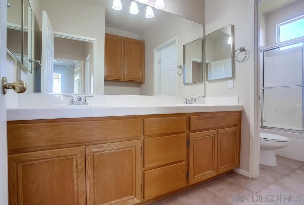 5163 Riverview Court Fallbrook, CA 92028 - Photo 57 of 75 a bathroom with a sink and a mirror