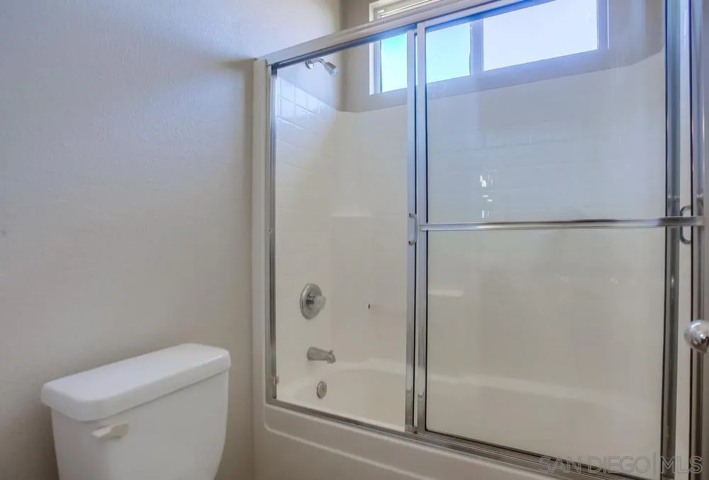 5163 Riverview Court Fallbrook, CA 92028 - Photo 58 of 75 a bathroom with a glass shower door