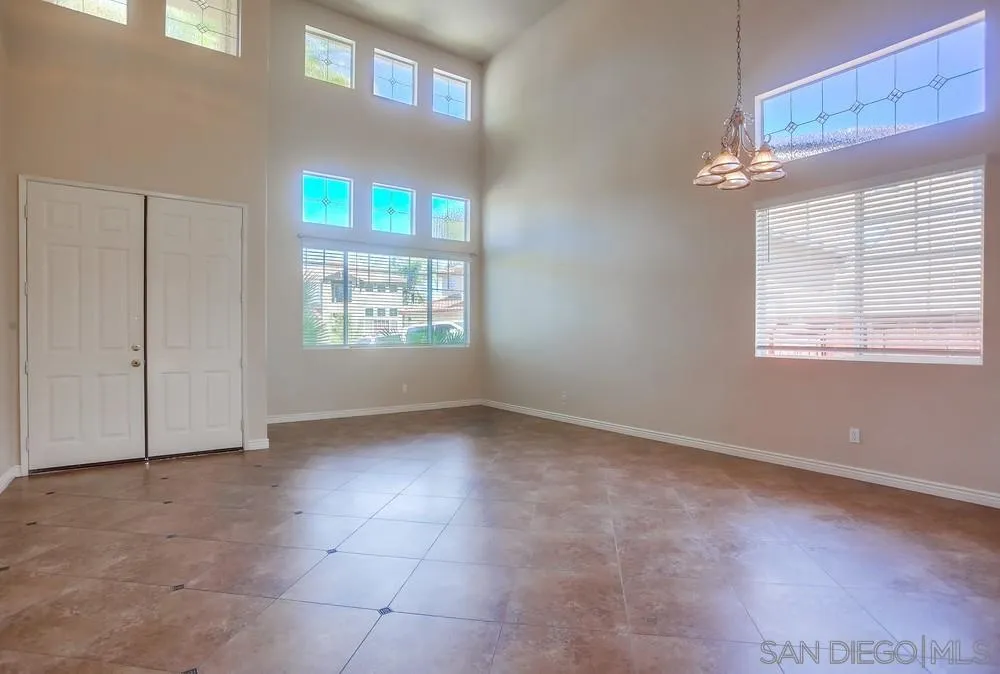 5163 Riverview Court Fallbrook, CA 92028 - Photo 6 of 75 an empty room with windows and closet