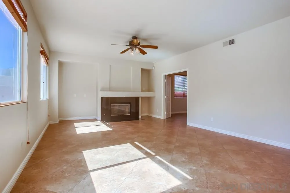 5163 Riverview Court Fallbrook, CA 92028 - Photo 8 of 75 a view of a livingroom with a fireplace and window