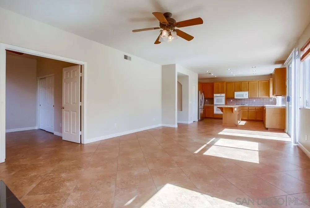 5163 Riverview Court Fallbrook, CA 92028 - Photo 9 of 75 a view of a livingroom with a ceiling fan and window