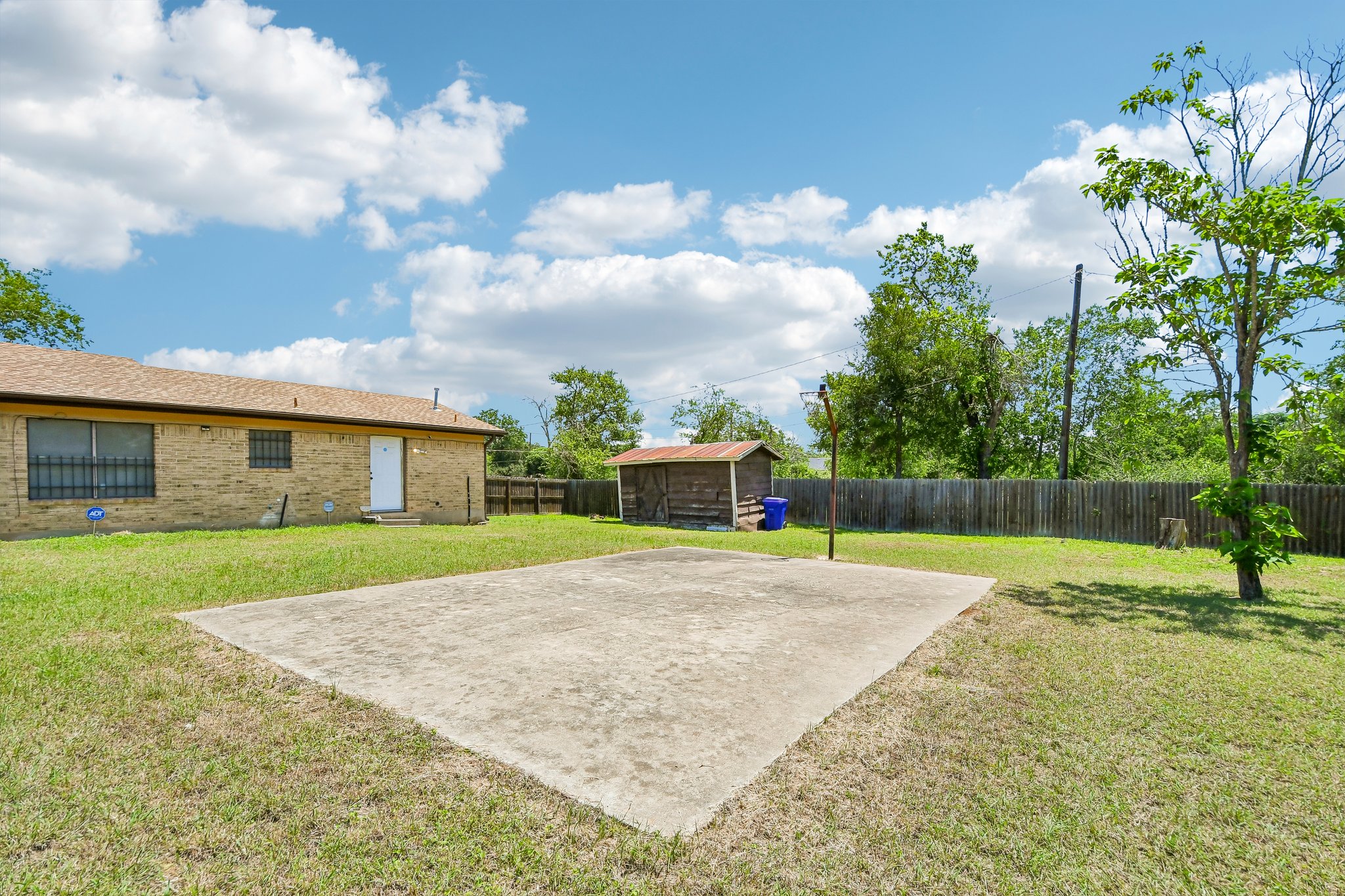 101 Brown Street Elgin, TX 78621 - Photo 29 of 32 a house with garden in front of it